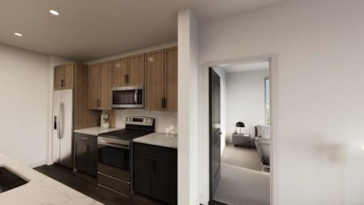 A modern kitchen with wooden cabinets and black appliances.