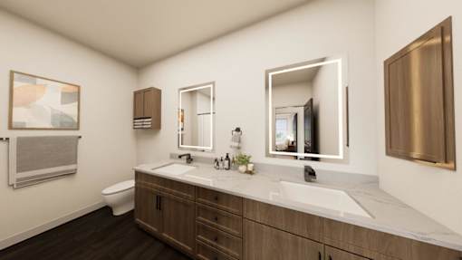 A modern bathroom with a large mirror and a white sink.