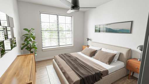 A bedroom with a bed, a ceiling fan, and a window with blinds.