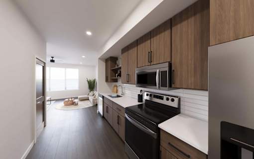 Kitchen with black appliances at The Union Flats at Fishers District, Fishers