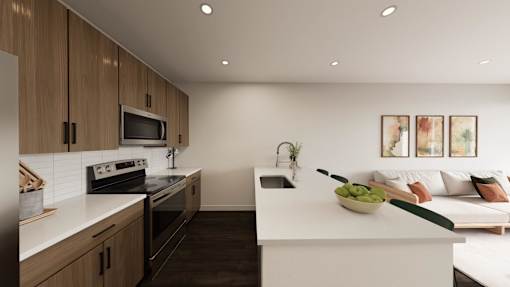 A modern kitchen with wooden cabinets and a white countertop.