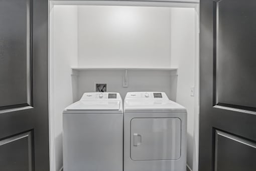 Laundry closet with side by side washer and dryer at Velara Luxury Apartments, Florida, 32081