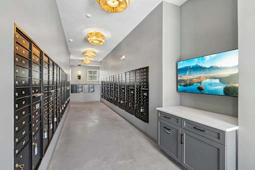Mail room with lockable mailboxes and decorative lighting at Velara Luxury Apartments, Ponte Vedra Beach, Florida