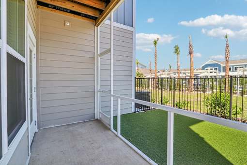 Private balcony with metal railing and palm tree views at Velara Luxury Apartments, Florida, 32081