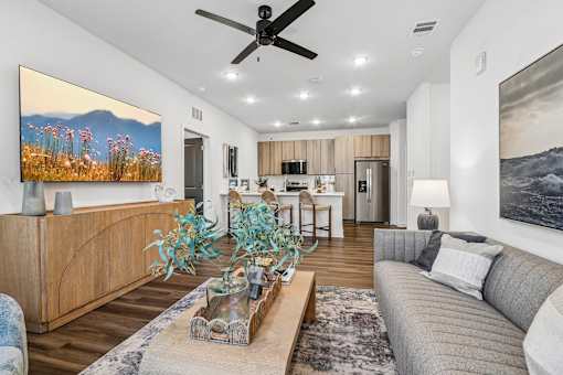 Open living area with kitchen and modern furnishings at Velara Luxury Apartments, Florida, 32081