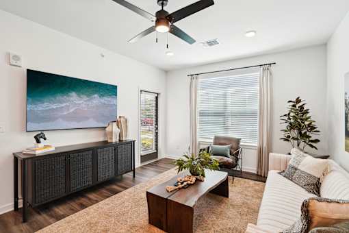 Living Room With Ceiling Fan at The Pullman Luxury Apartments, Atlanta