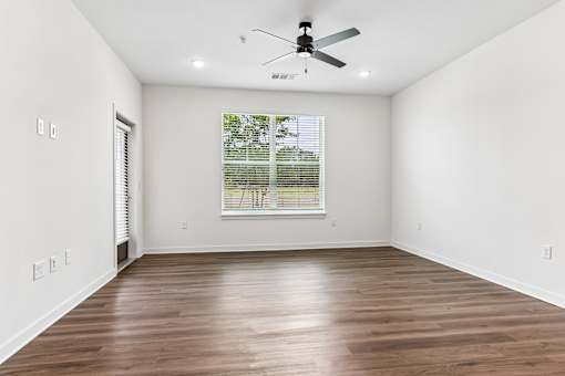 Spacious empty room with window and hardwood floors at Velara Luxury Apartments, Ponte Vedra Beach, Florida