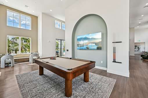 A pool table in a room with a painting on the wall at The Hadley - North Port, FL Apartments, Florida, 34287