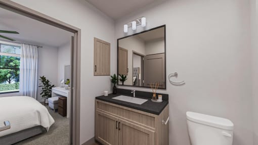 a bathroom with a toilet and a sink and a mirror  at Alta25, Monument, 80132