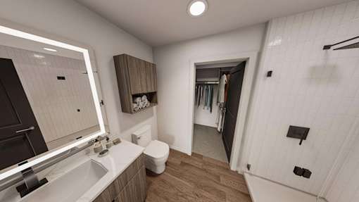 A bathroom with a white sink and a mirror.