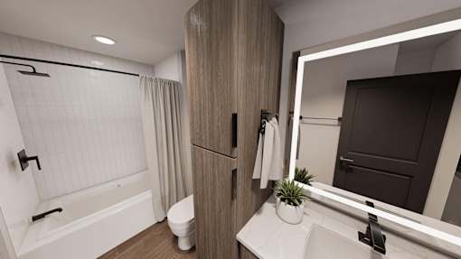 A bathroom with a white tub, sink, and toilet.