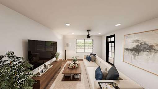 A modern living room with a white couch, a coffee table, and a large painting on the wall.