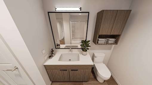 A bathroom with a white sink and a white toilet.