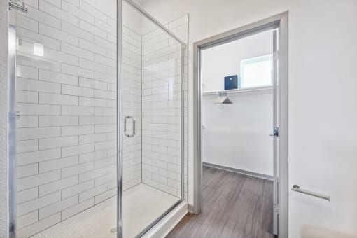 Bathroom with a shower and a door at Citadel at Castle Pines, Castle Pines, CO, 80108