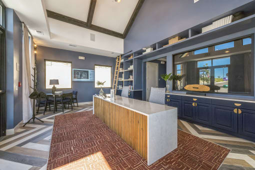 a kitchen with blue cabinets and a large island in the middle at Citadel at Castle Pines, Colorado