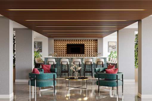 A modern living room with a fireplace and comfortable seating at Refinery at Pointe17 Apartments, Phoenix, Arizona