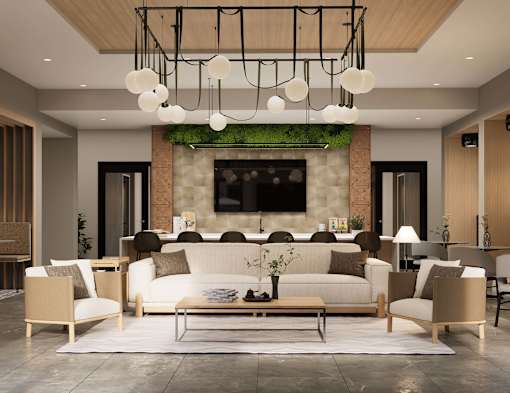 A modern living room with a white sofa set and a green plant on the fireplace.