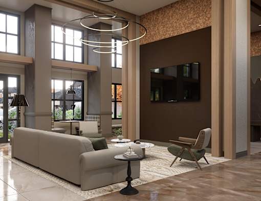 A modern living room with a large couch, a chair, and a coffee table.