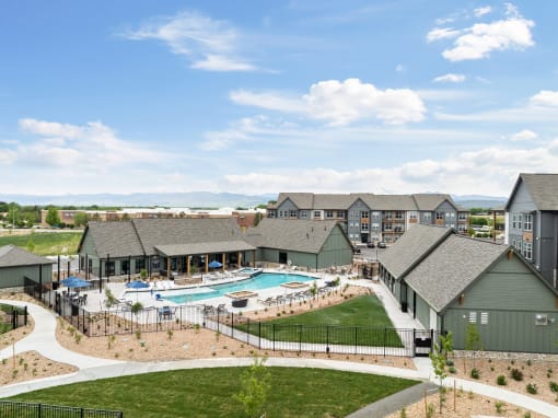 an aerial view of an apartment complex with a swimming pool at Notch66, Longmont, Colorado