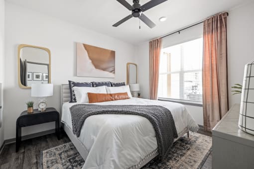 a bedroom with a bed and a ceiling fan at Notch66, Longmont, Colorado