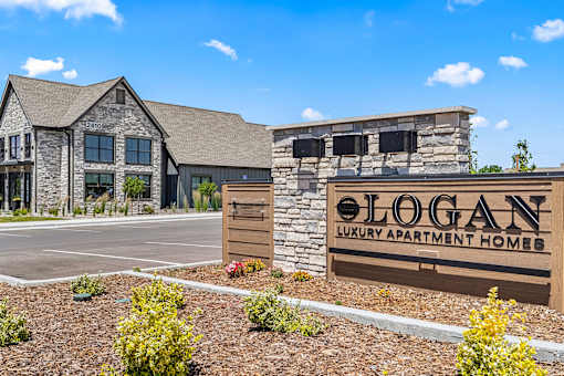 The image shows a building with a sign that reads