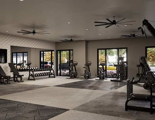 A spacious gym with a variety of equipment and a checkered floor.