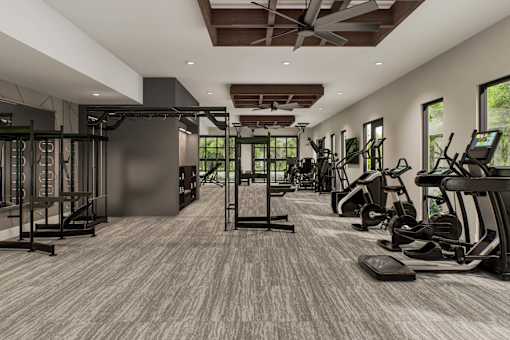 A spacious gym with a variety of equipment and a large mirror on the wall.
