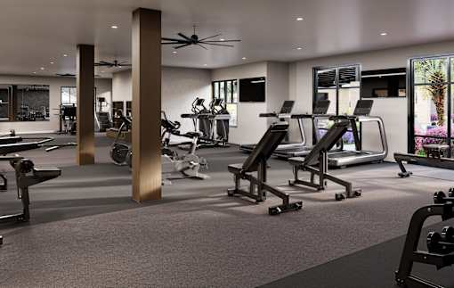 A spacious gym with treadmills, elliptical machines, and other exercise equipment.