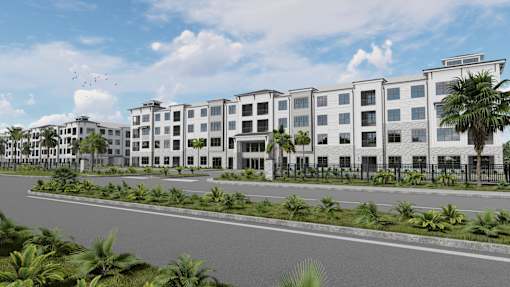 A modern building complex with a road in front and palm trees around at The Stadler Luxury Apartments, Florida 34210