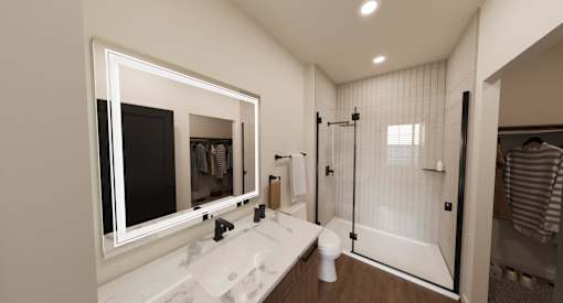 A bathroom with a marble sink and a walk-in shower.