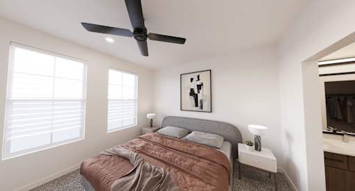 A bedroom with a bed, a ceiling fan, and a window with blinds.