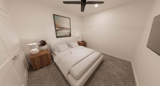 A bedroom with a bed, a side table with a plant, and a painting on the wall.