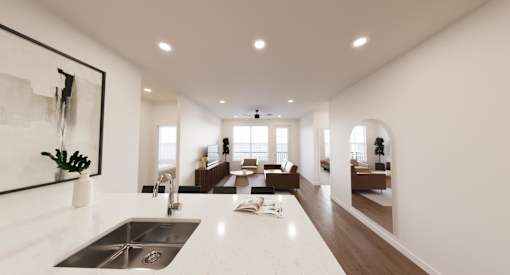 A modern kitchen with a large island and a sink.
