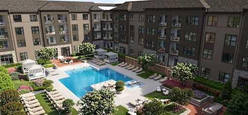 A large swimming pool surrounded by lounge chairs and umbrellas in the middle of a courtyard.