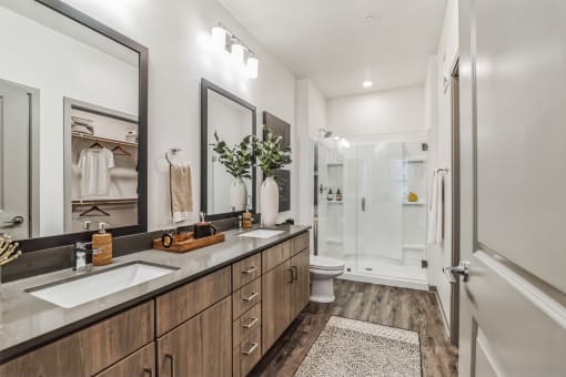 a bathroom with two sinks and a shower at Canter, Ocala, Florida