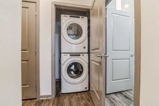 a front loading washer and dryer in a laundry room at Canter, Ocala, Florida