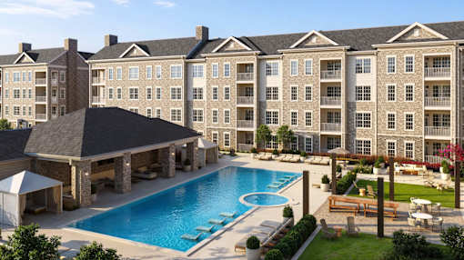 A large building with a pool in front.