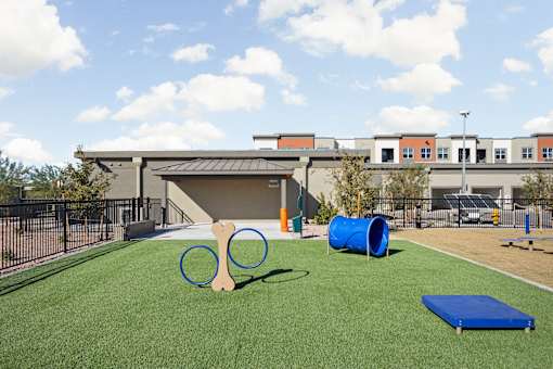 our apartments have a playground with a tennis racket and cones at The Maddox Luxury Apartment Homes, Buckeye