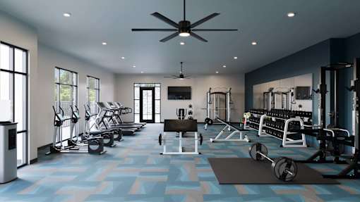 A gym with a variety of equipment including weights and a treadmill.