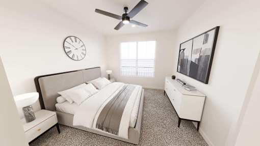 A bedroom with a bed, nightstand, and a ceiling fan.