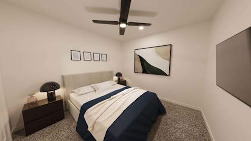 A bedroom with a bed, nightstand, and ceiling fan.