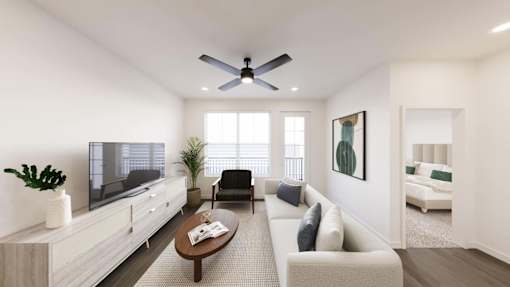 A modern living room with a white sofa, a wooden coffee table, and a flat-screen TV.