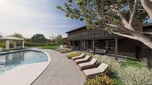 A modern house with a pool and lounge chairs.