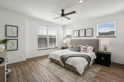a bedroom with a bed and a ceiling fan at Meridian at CityPlace, Woodbury, Minnesota