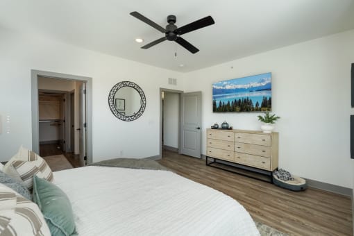 a bedroom with a bed and a ceiling fan at Meridian at CityPlace, Woodbury, Minnesota 55125