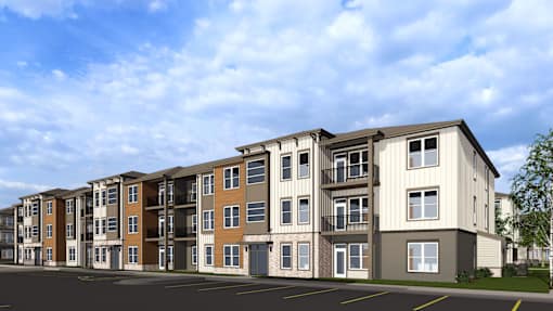 A row of modern apartment buildings with balconies and garages at The Logan Luxury Apartments, Idaho, 83651