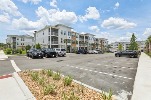 an empty parking lot in front of an apartment building at Drift, Daytona Beach, FL, 32117
