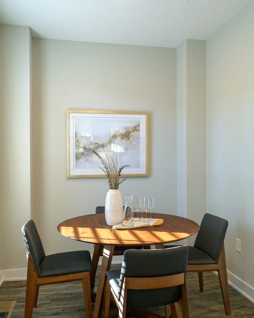 a dining room with a wooden table and chairs  at Oakbrook Townhomes, Franklin, TN