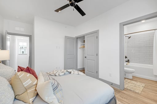a bedroom with a large bed and a ceiling fan at Meridian at CityPlace, Minnesota, 55125