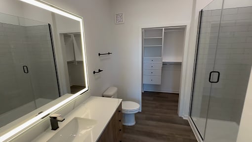 A white sink with a mirror above it.